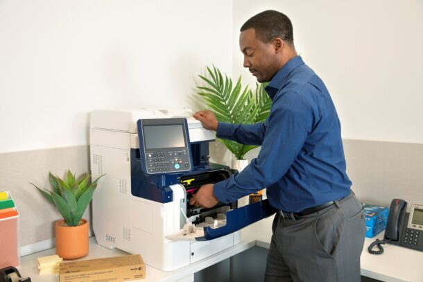 man using a xerox printer