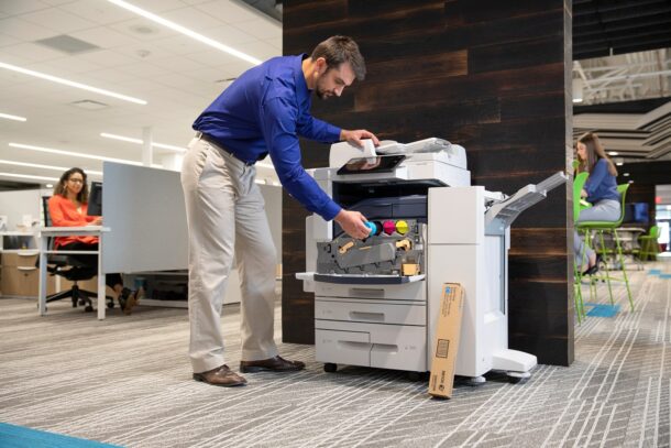 man using a xerox printer