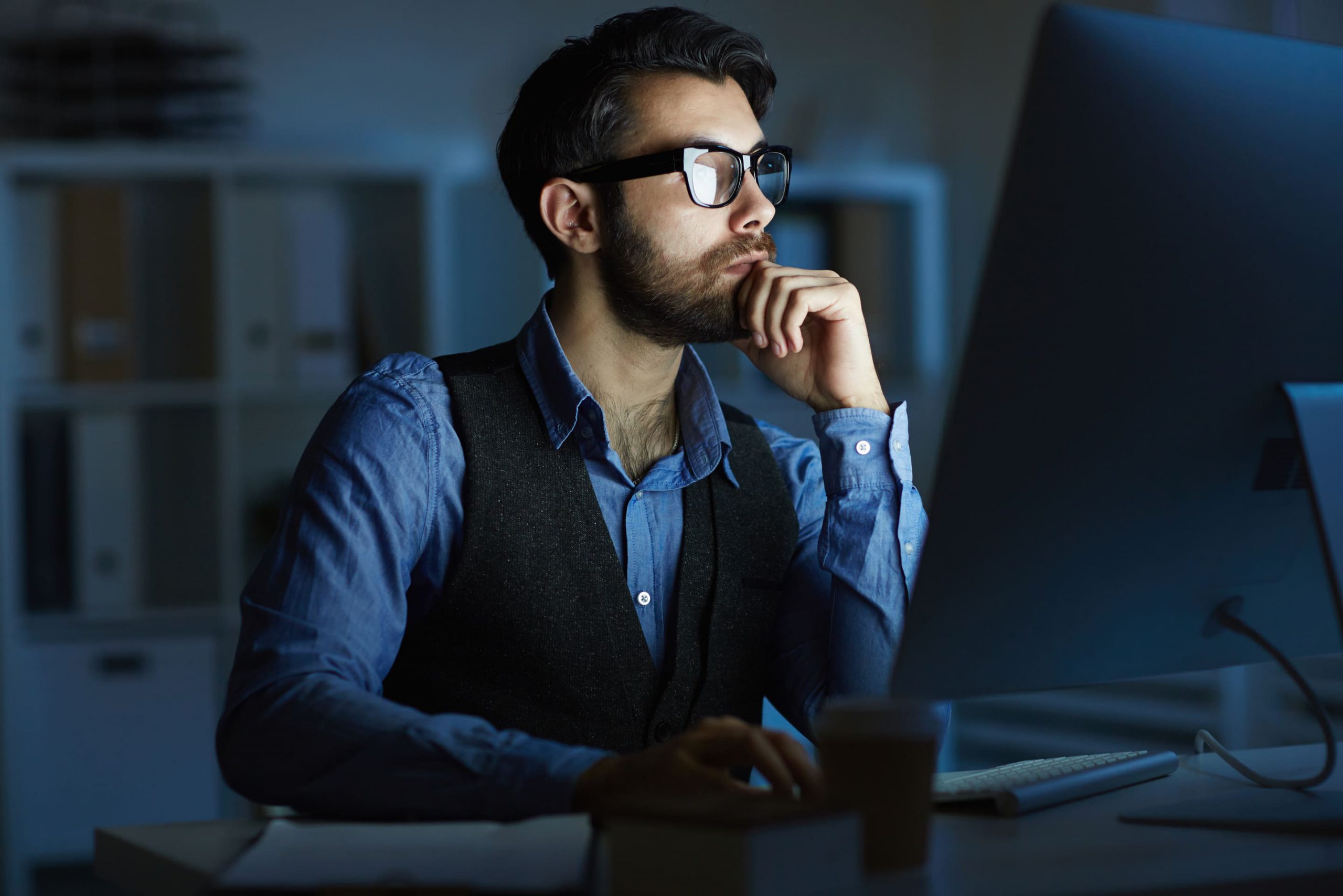 man sitting at a computer