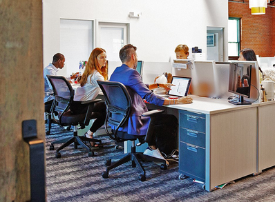 people sitting at office desk