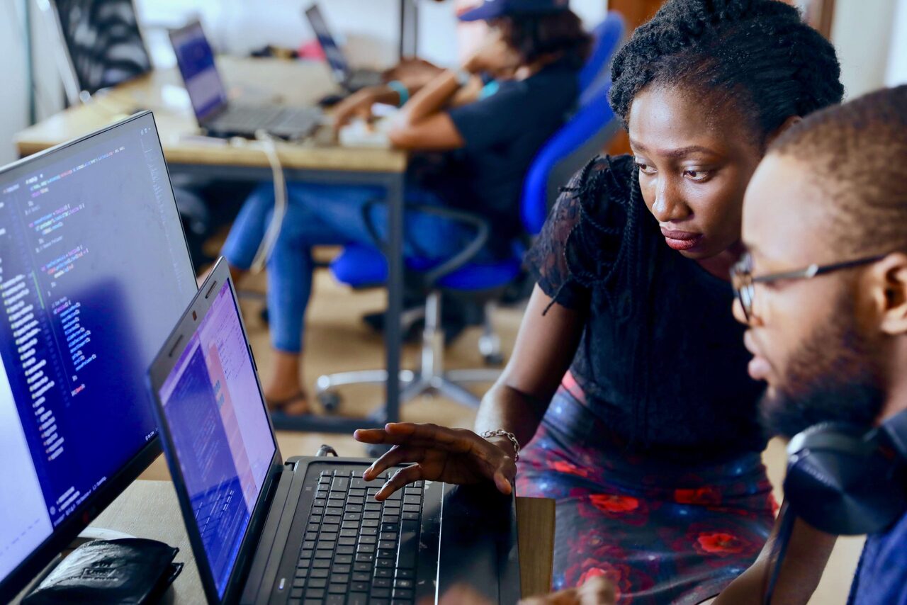 two people looking at computer